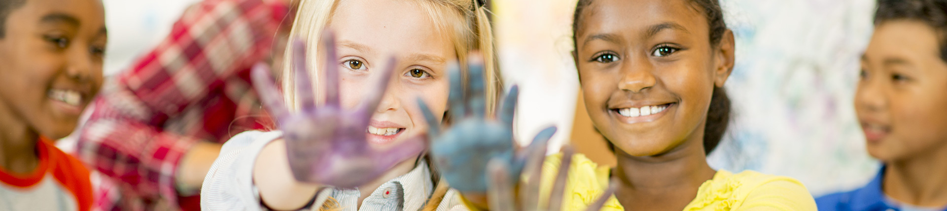Two girls with paint on hands